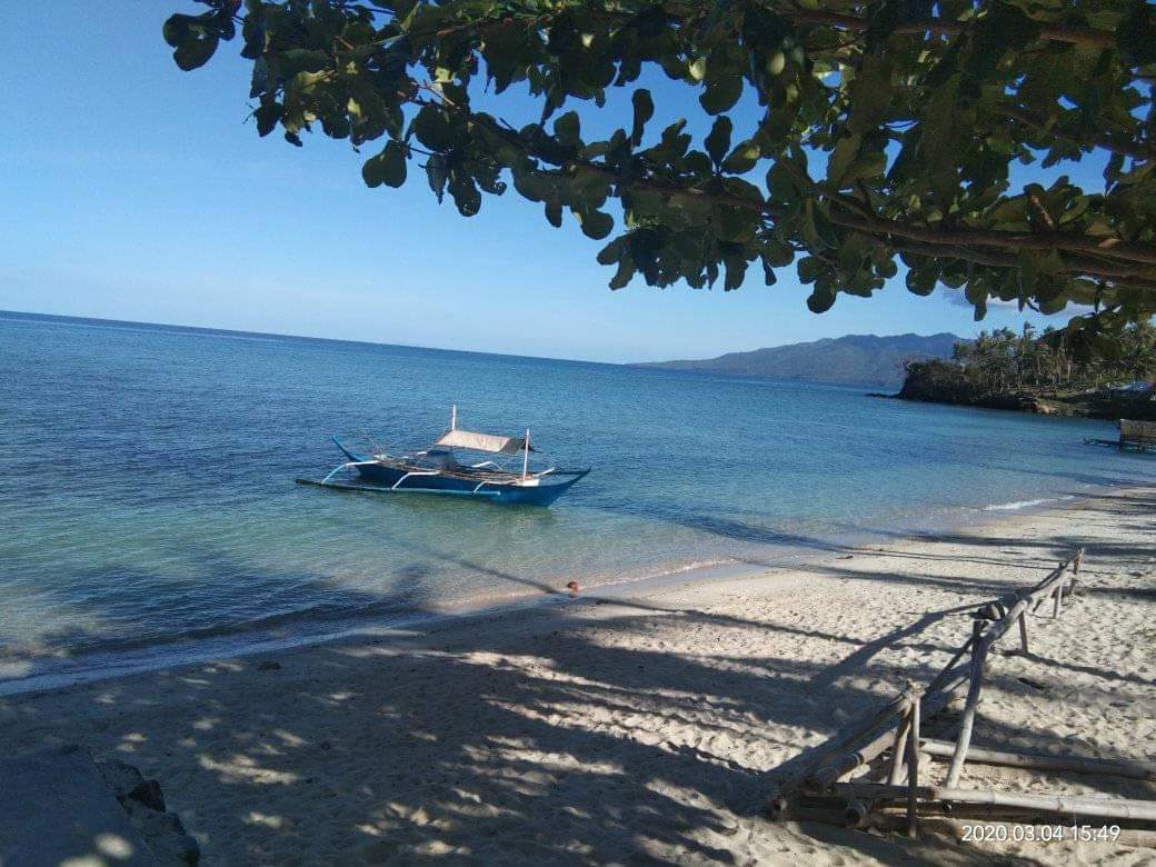 Foto von Tagumpay Beach mit geräumiger strand