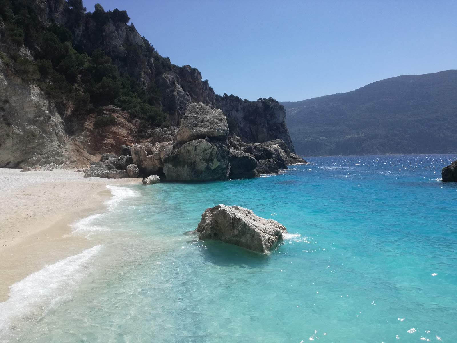 Photo of Afales Beach with turquoise pure water surface