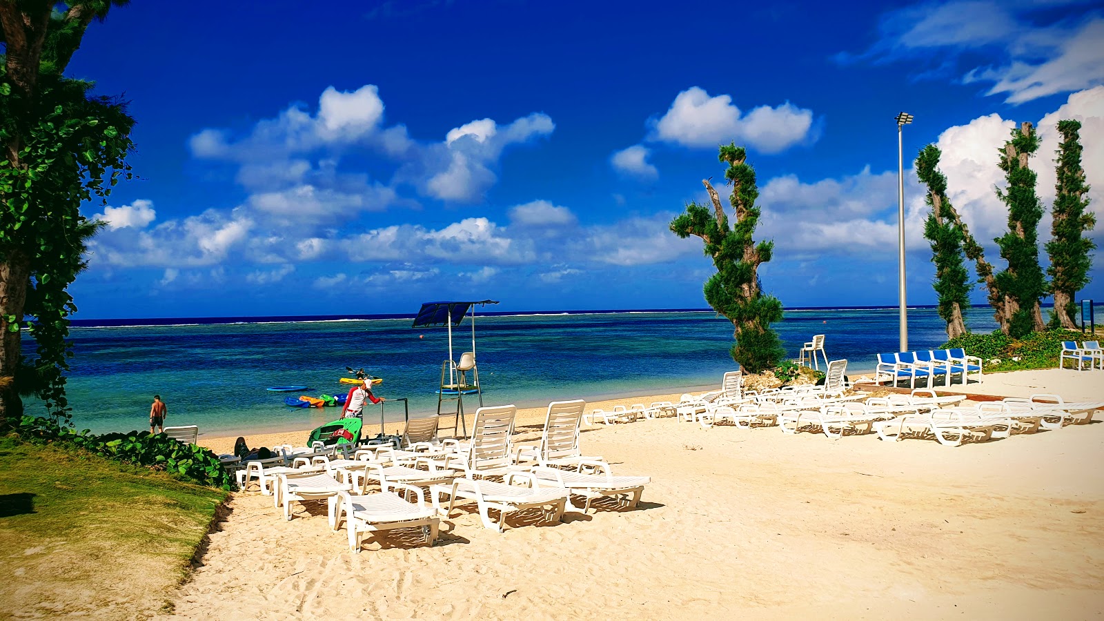 Fotografija Pacific islands Club z svetel pesek površino