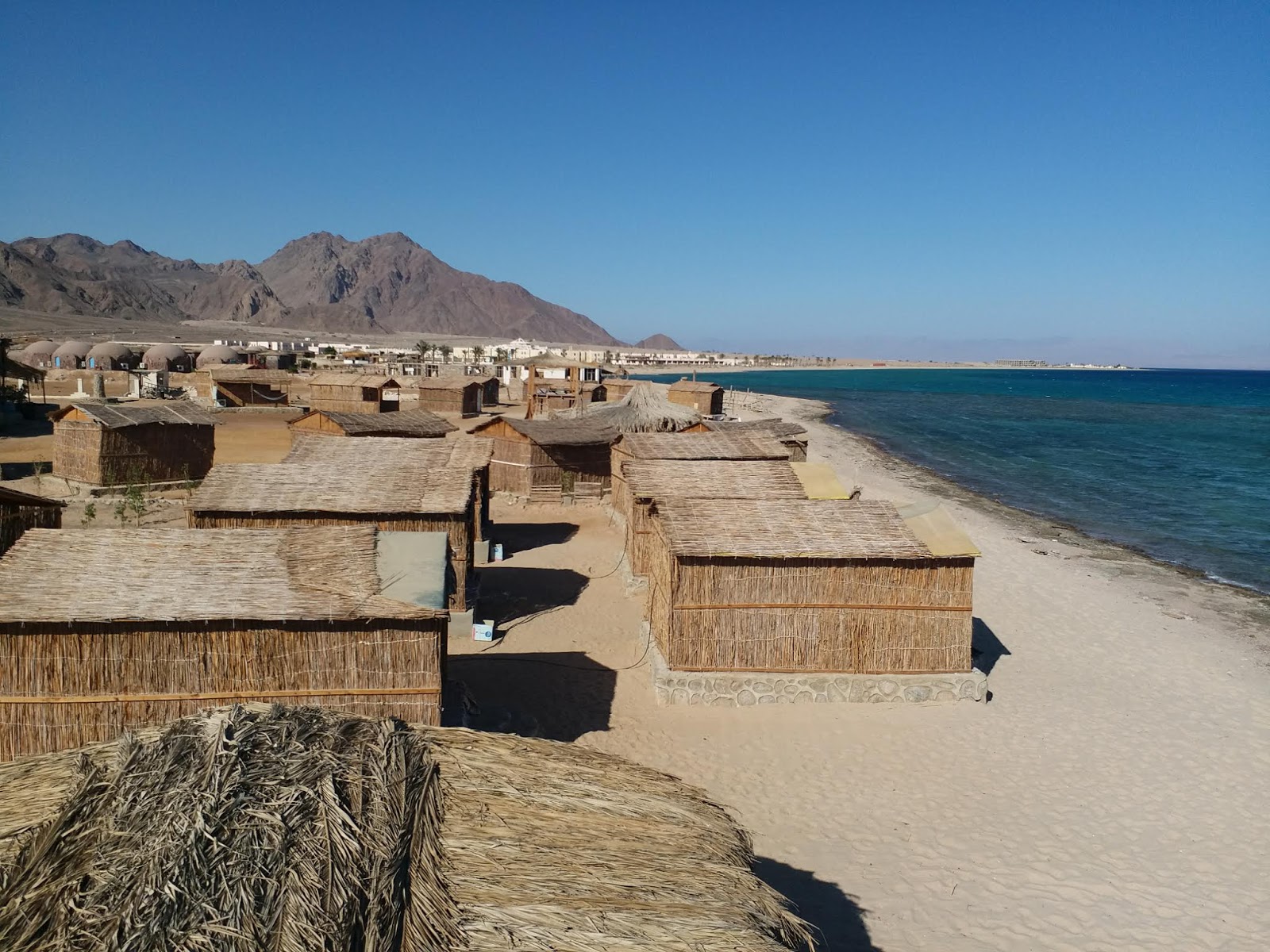 Foto van Al Magarra beach en de nederzetting