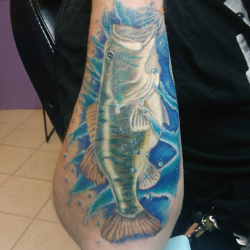 Explore butterfly back tattoo ideas, creative tattoo ideas in Owosso, available at Expressions Body Art Studio