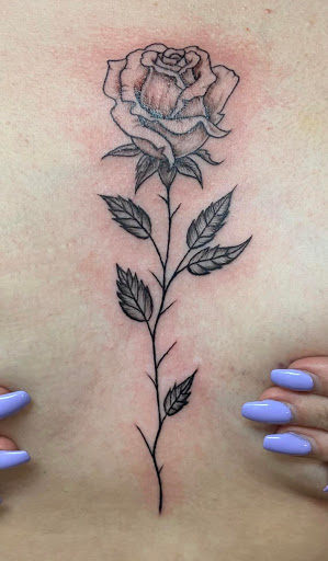 Explore cover up tattoo ideas on hand, creative tattoo ideas in Brunswick, available at Blue Fin Tattoos