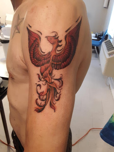 Find tattoo ideas for upper arm men for your next unique tattoo in Hanceville at Wildman Tattoo and Body Piercing