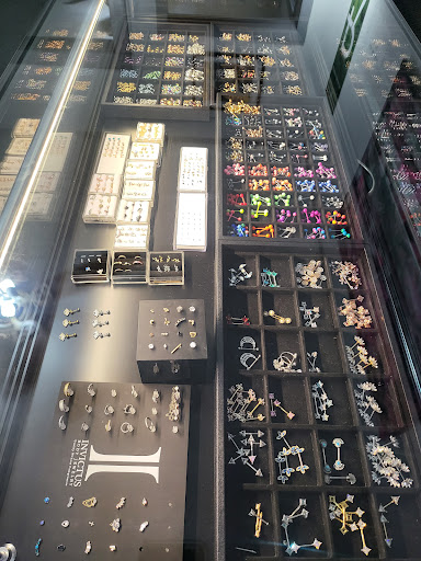 Explore back ear tattoo ideas, creative tattoo ideas in Sheridan, available at The Poke Palace