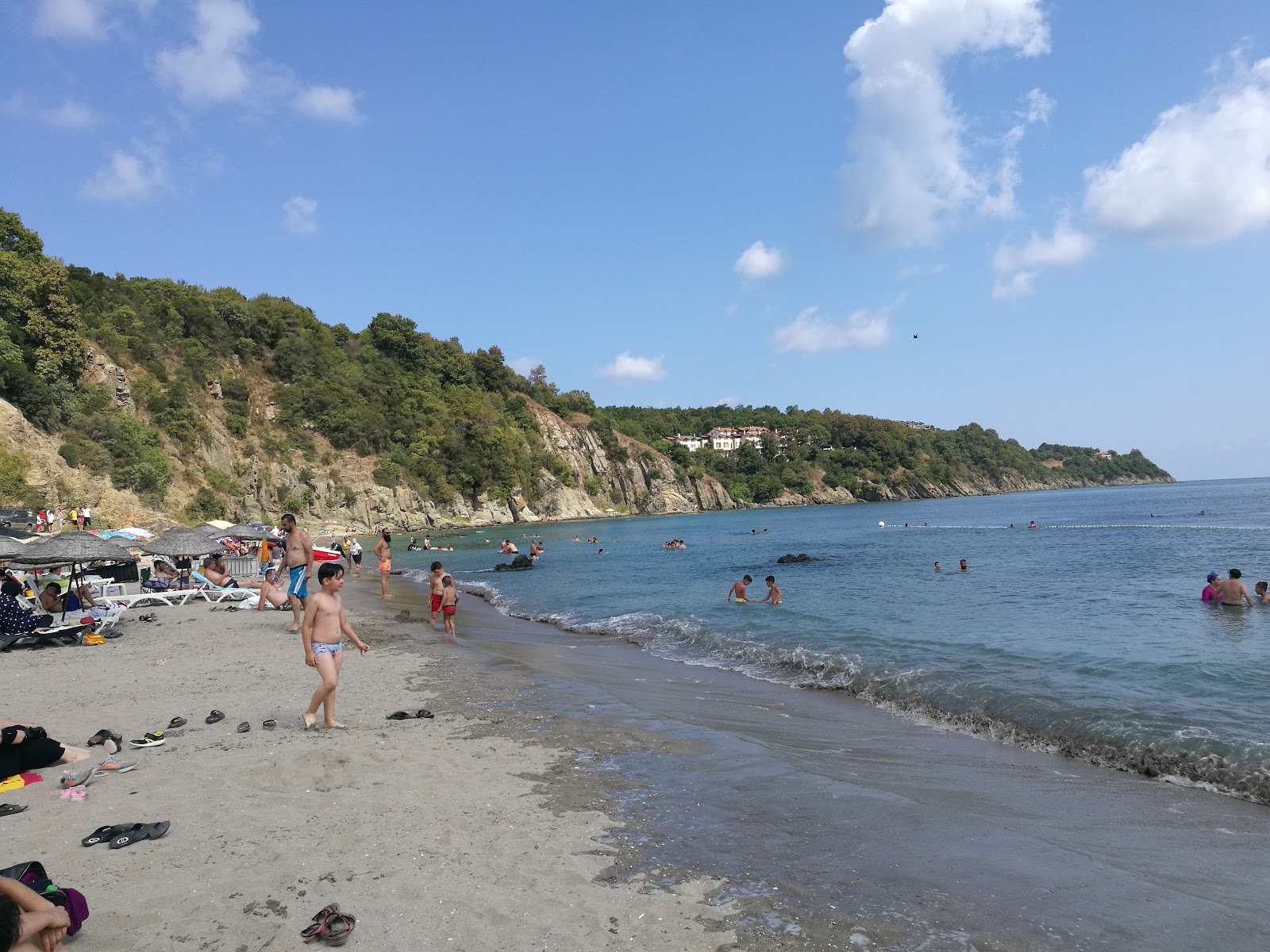 Foto di Lovers beach con una superficie del sabbia beige