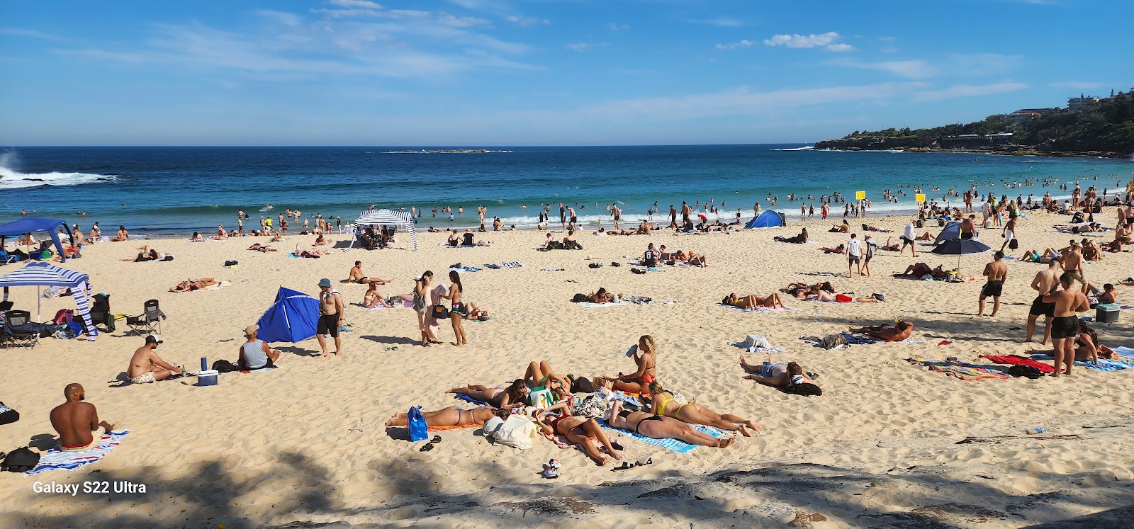 Photo of Coogee Beach with turquoise pure water surface