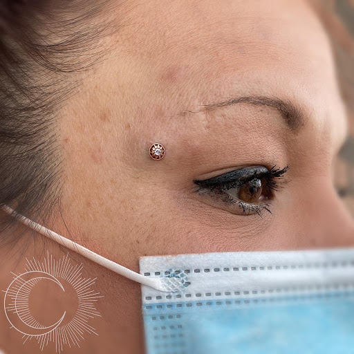 Explore mens cover up tattoo ideas, creative tattoo ideas in Appleton, available at Celestial Piercing- Inside of Big Guns Tattoo