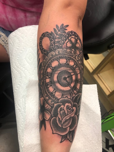 Explore lily tattoo ideas, creative tattoo ideas in Ferndale, available at Signature Tattoo