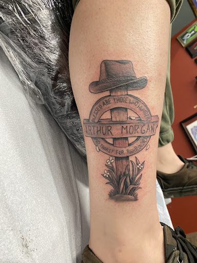 Explore cross stitch tattoo ideas, creative tattoo ideas in West Point, available at Liquid Metal Tattoo & Body Piercing