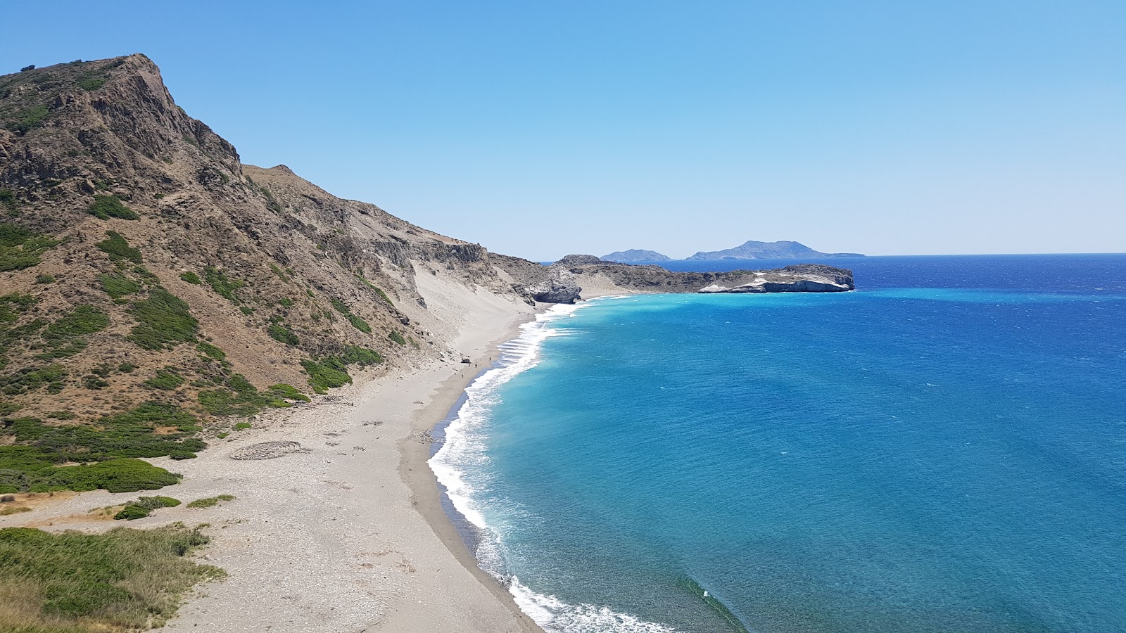 Agios Pavlos beach II的照片 带有灰色细卵石表面