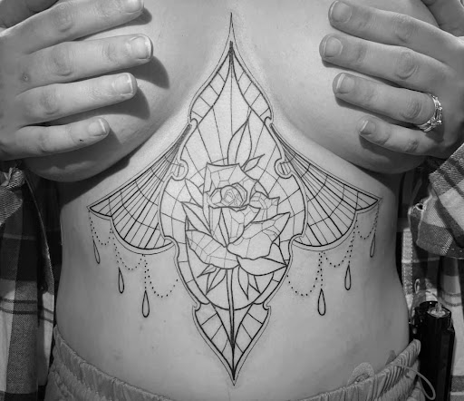 Find underboob tattoo idea for your next unique tattoo in Hartselle at Ethereal Alchemy Tattoo Collective