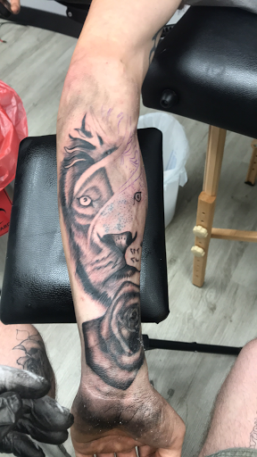 Explore cover up tattoo ideas for guys, creative tattoo ideas in Cadillac, available at Limitless Ink Tattoo Studio