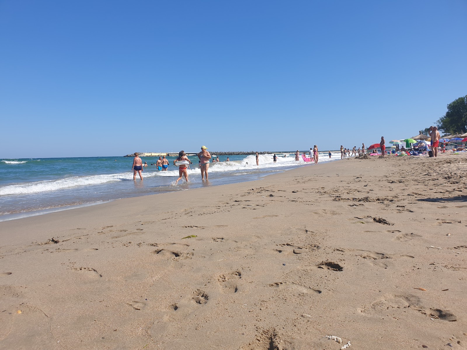 Zdjęcie Poseidon beach z przestronna plaża