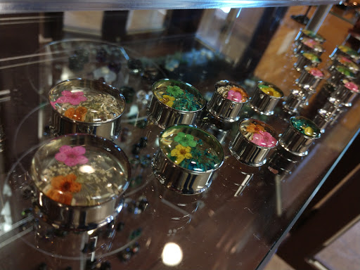 Explore small ear tattoo ideas, creative tattoo ideas in North Charleston, available at Exotic Impressions Body Piercing