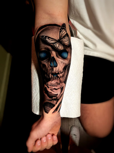 Explore tattoo ideas back arm, creative tattoo ideas in Johnson City, available at Gold Cross Tattoo Co.