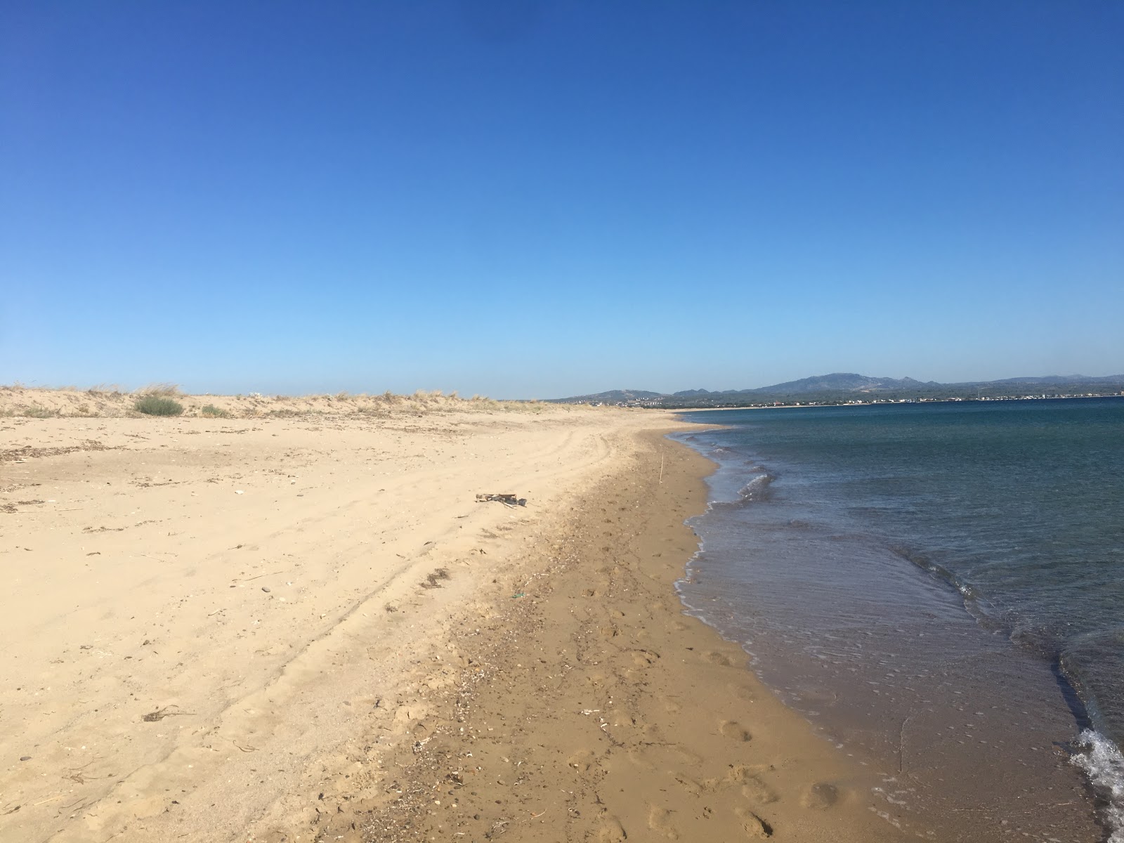 Foto di Kumburnu beach con una superficie del sabbia con ciottolame