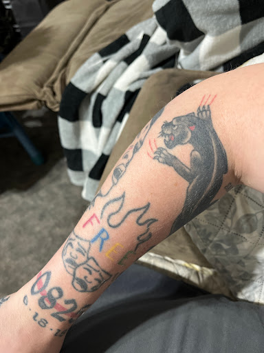 Explore thigh tattoos ideas for guys, creative tattoo ideas in Beaufort, available at Kiss of Ink Tattoo