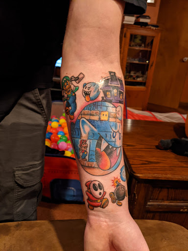 Explore leg tattoos men ideas, creative tattoo ideas in Erie, available at Ink Assassins