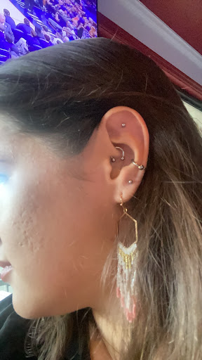 Find inbetween boob tattoo ideas for your next unique tattoo in North Charleston at Exotic Impressions Body Piercing