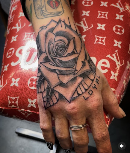 Explore yellow rose tattoo ideas, creative tattoo ideas in Fort Myers, available at Loyal 2 The Coil Tattoos & Piercings (Edison Mall Location Entrance F)