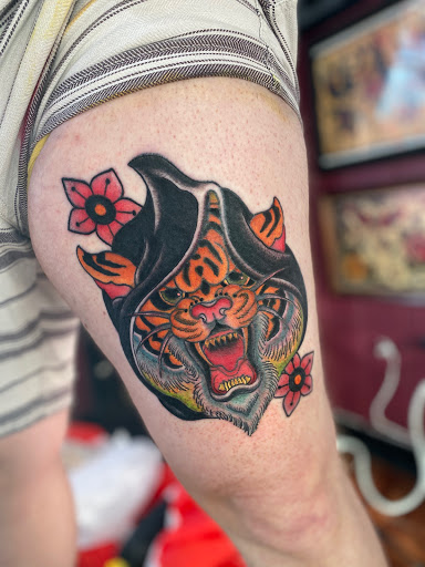 Explore tattoo ideas for happiness, creative tattoo ideas in Tampa, available at HAWKS ELECTRIC TATTOOS