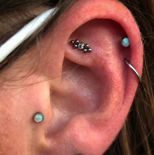 Explore cross tattoo ideas for guys, creative tattoo ideas in Oshkosh, available at Piercings by Molly Moon at 920 Tattoo and Piercing