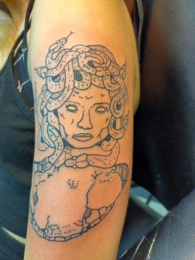 Find tattoo ideas mom for your next unique tattoo in Owosso at Twisted ink tattoo