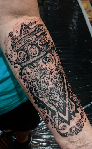 Explore black and grey sleeve tattoo ideas, creative tattoo ideas in Tea, available at Red Arbor Tattoo