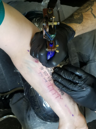 Explore rip cross tattoo ideas, creative tattoo ideas in Worcester, available at Unholy Grail Tattoo Inc