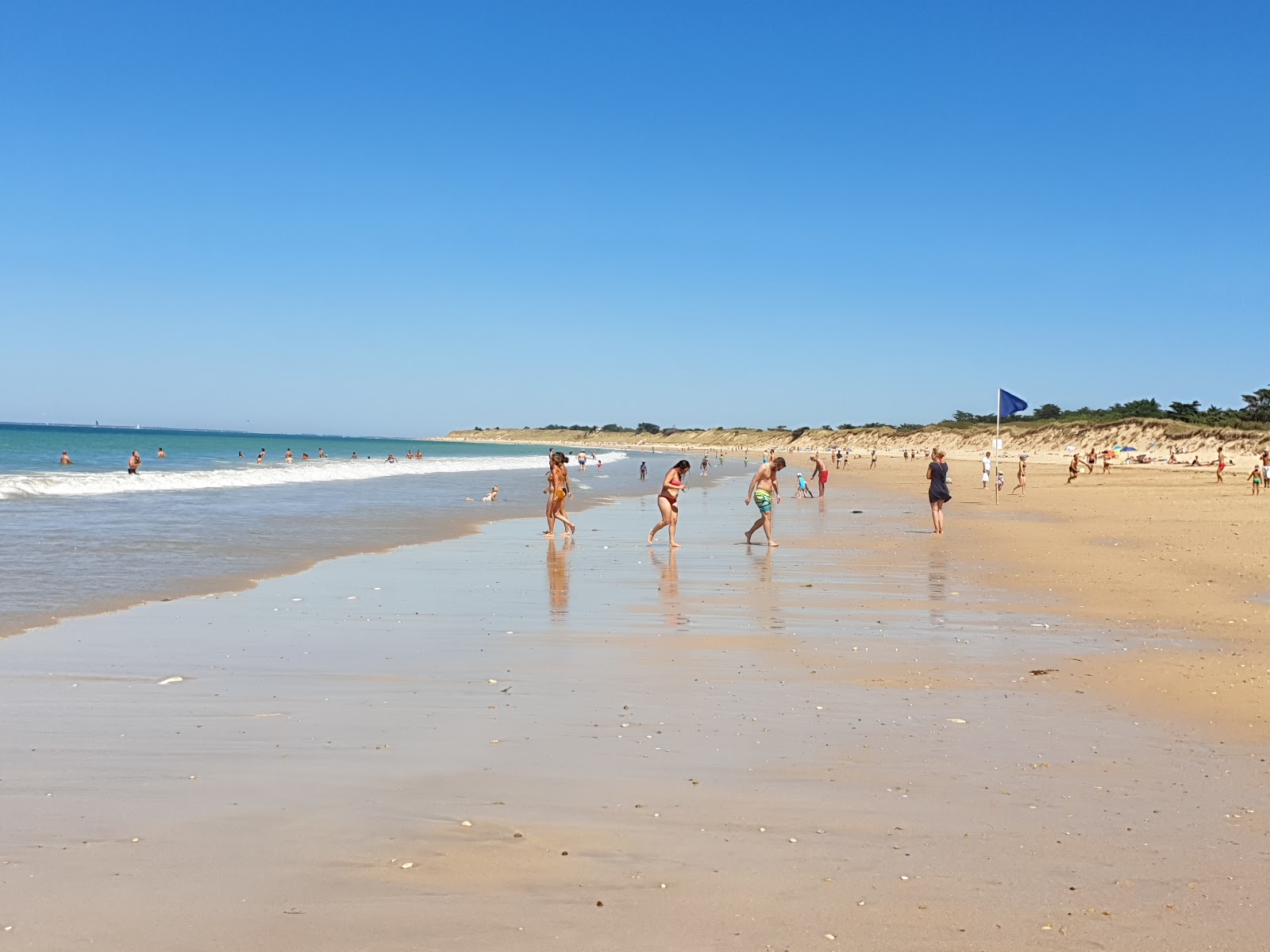Fotografija Conche of Whales beach z svetel pesek površino