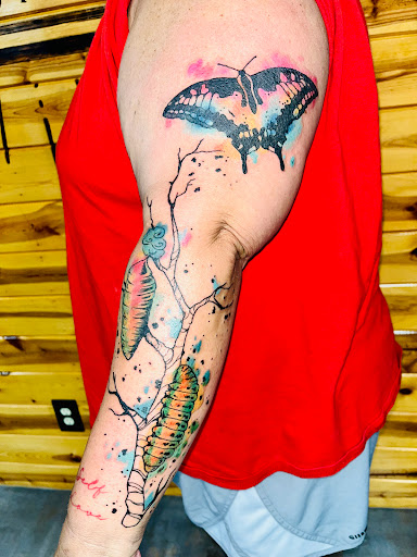 Find wolf tattoo ideas for females for your next unique tattoo in Foley at Symbolic Ink Tattoo Studio