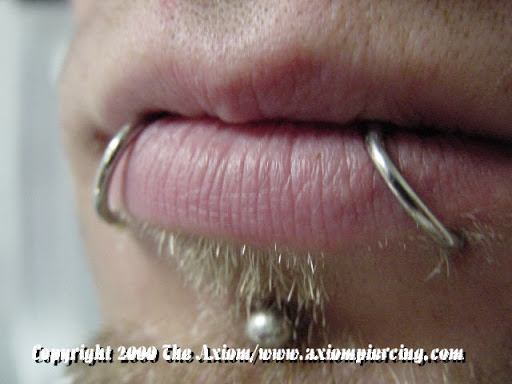 Explore smile tattoo ideas, creative tattoo ideas in Des Moines, available at Axiom Body Piercing Studio