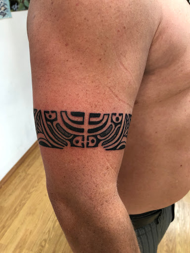 Explore bow and arrow tattoo ideas, creative tattoo ideas in Lahaina, available at Sweet Trade Tattoo