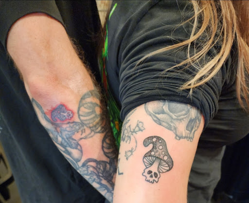 Explore neck tattoo ideas for females, creative tattoo ideas in Athens, available at Skin Hooked Tattoo & Body Piercing