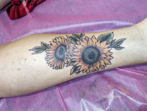 Explore tattoo sleeve ideas lion, creative tattoo ideas in Cornelia, available at Prismatic Pulse Tattoo
