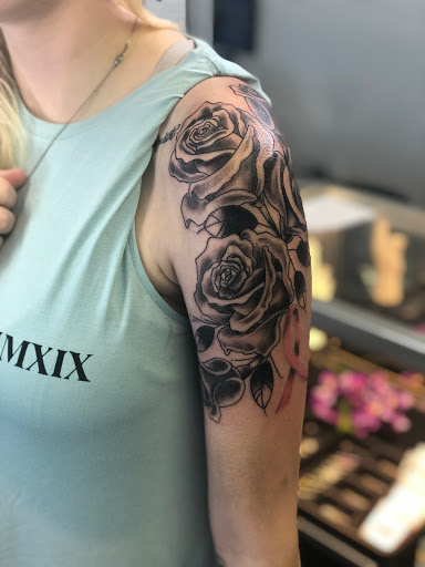 Find tattoo ideas for woman on leg for your next unique tattoo in Barberton at Magic City Tattoo Company
