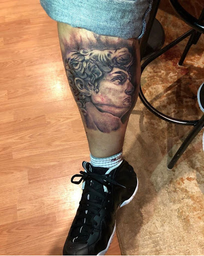 Explore muscle tattoo ideas, creative tattoo ideas in New Haven, available at Dali Tattoos LLC