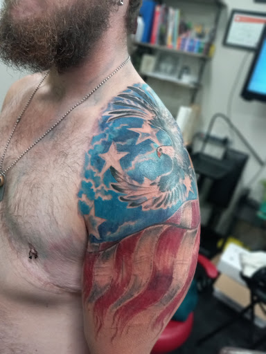 Explore american traditional elbow tattoo ideas, creative tattoo ideas in Slippery Rock, available at Dinky Dachshund Tattoo Parlor