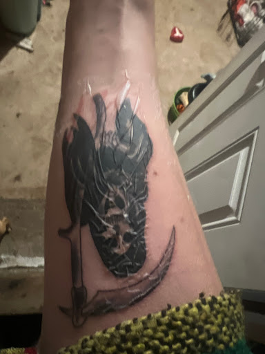 Explore knee cap tattoo ideas for men, creative tattoo ideas in Tacoma, available at Make It Sick Tattoo