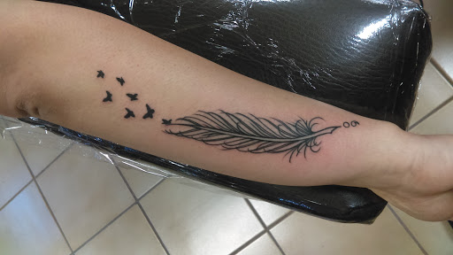 Explore purple rose tattoo ideas, creative tattoo ideas in Albuquerque, available at Albuquerque Ink Tattoo