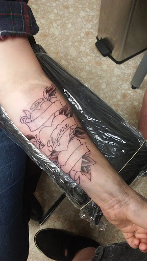 Explore female wonder woman tattoo ideas, creative tattoo ideas in Wallace, available at Dans Tattoo Shop