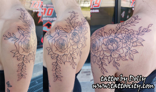 Explore tattoo ideas for women thigh, creative tattoo ideas in Lockport, available at Tattoo City by Larry Brogan