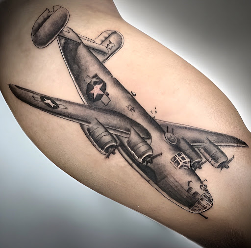 Explore curious george tattoo ideas, creative tattoo ideas in Huntington, available at Timeless Tattoo Gallery