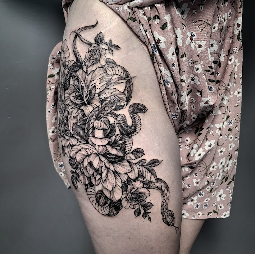 Explore knee cap tattoo ideas for men, creative tattoo ideas in Asheboro, available at Wonderland Tattoo