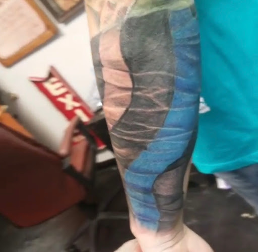 Explore memorial tattoo ideas for guys, creative tattoo ideas in Kenosha, available at Kenosha Tattoo Company