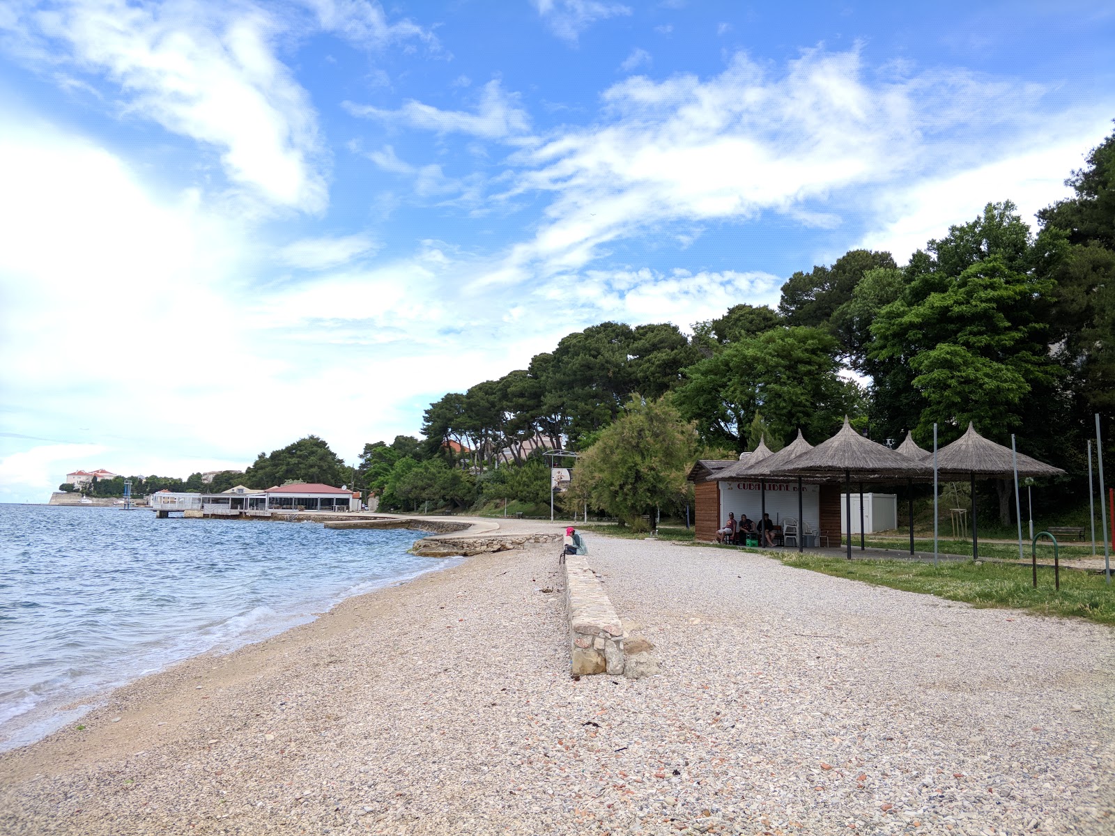 Photo de Plage de Kolovare avec l'eau cristalline de surface