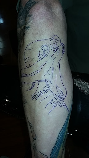 Explore neck tattoo idea men, creative tattoo ideas in Orange, available at Lincoln Avenue Tattoo