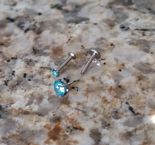 Explore hand tattoos ideas for men, creative tattoo ideas in Kearney, available at Studio 5150 Piercing & Fine Jewelry