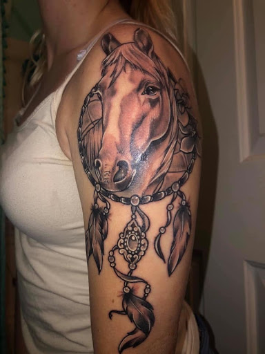 Explore women's lower back tattoo ideas, creative tattoo ideas in Goose Creek, available at Red Kirin Tattoo