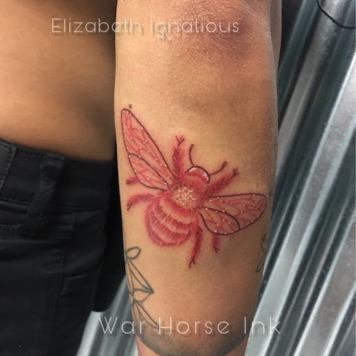 Explore ripped skin tattoo ideas, creative tattoo ideas in Kent, available at War Horse Ink